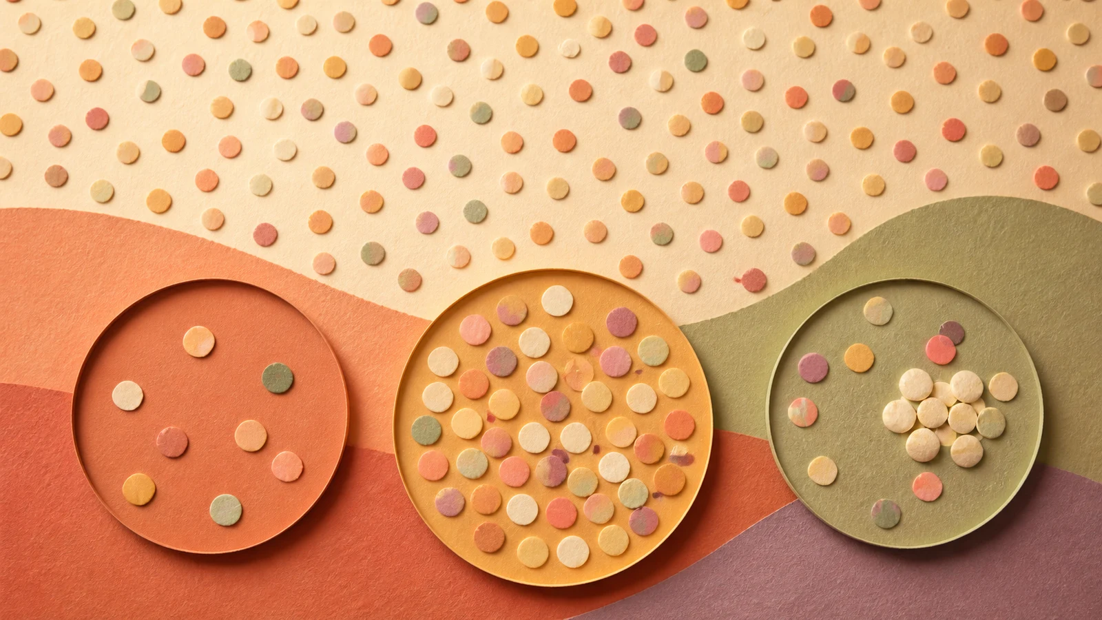 Cut-paper artwork showing a wide field of coloured dots above three local circles with very different concentrations